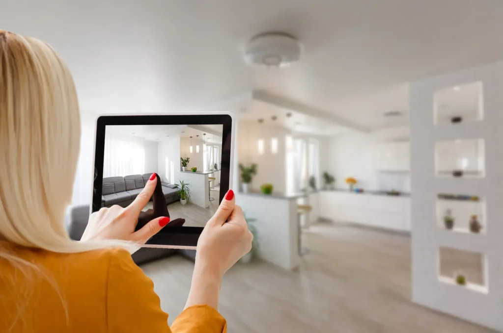 Real Estate Photography Preview of Modern Home Interior Woman reviewing professional real estate photography on a tablet to help sell your house online